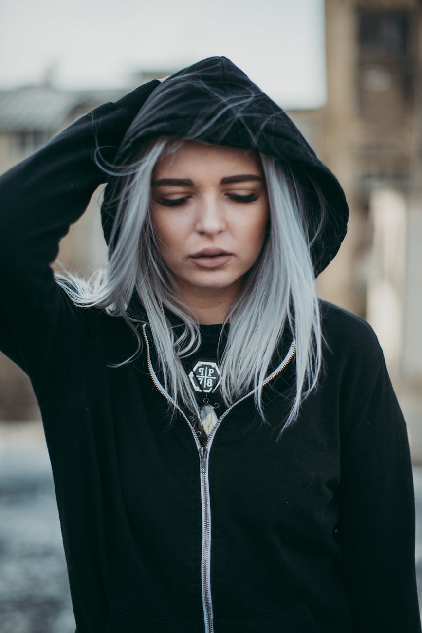 woman in black zip up hoodie and blonde hair