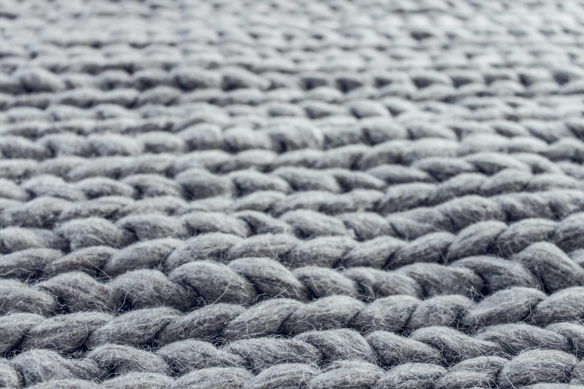 close up of gray cable knit cloth