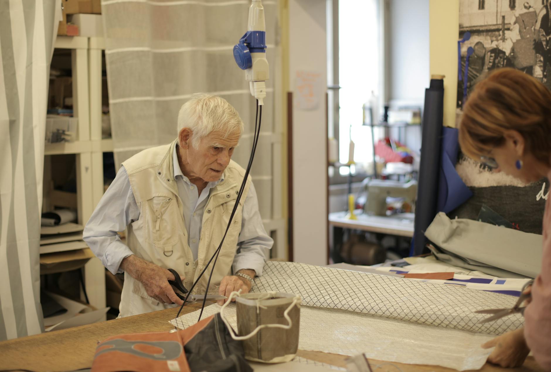 photo of man cutting using scissors