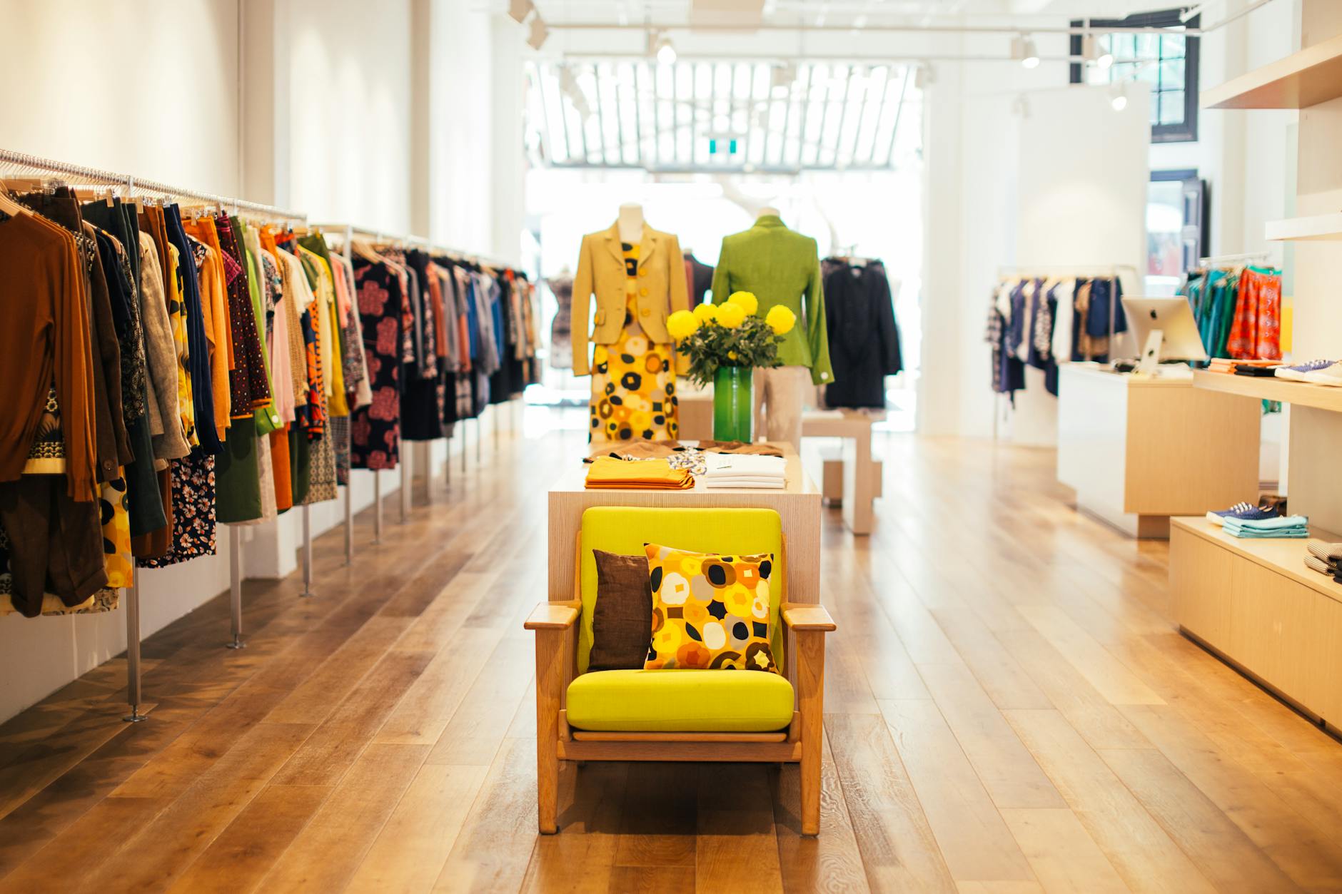 interior of stylish boutique with colorful clothes